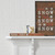shelf with framed wooden decor with winter themed sentiments written on them