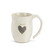Side view of white mug that says 'warm' on it in grey above grey heart