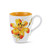 white mug painted orange inside with painted flower on outside