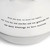 detail shot of sentiment on lid of white ceramic dish