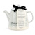 white ceramic teapot with words Warm and Cozy served Daily printed on outside tied to product label