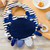 blue bib with crab decal with multipatterned pull tabs