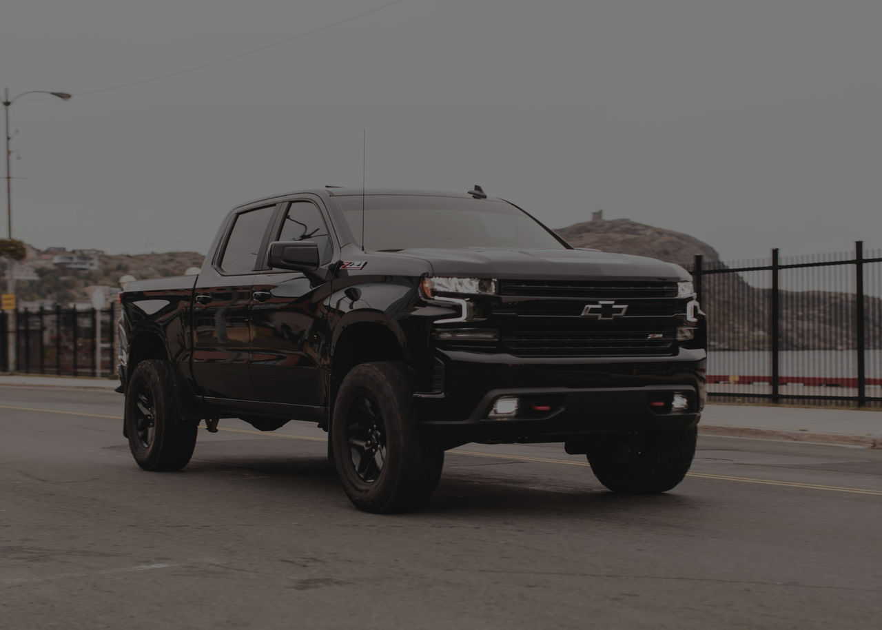 Black ford truck on bridge