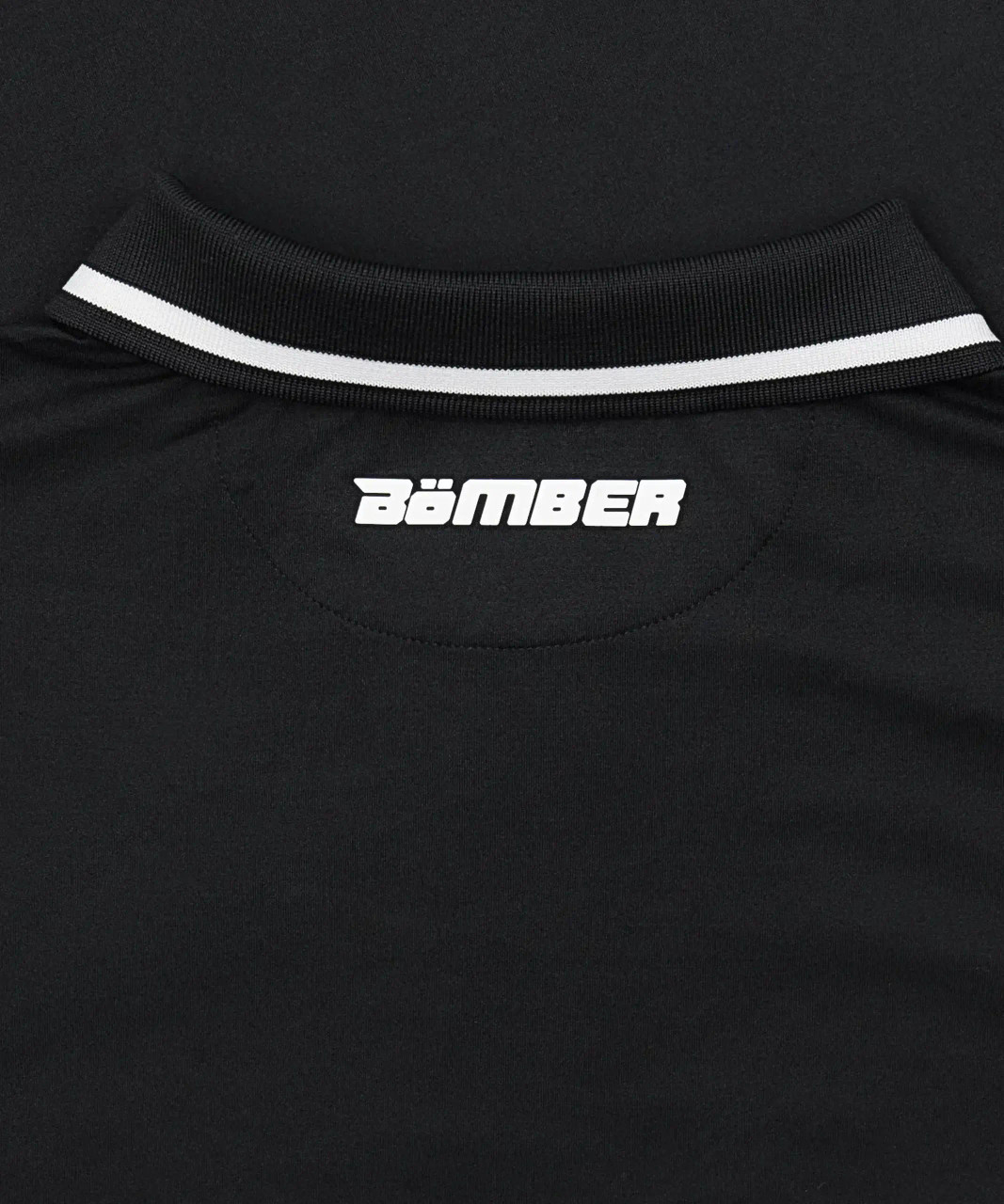 Interior neck sweat loop detail on men’s HydrApex™ black performance polo