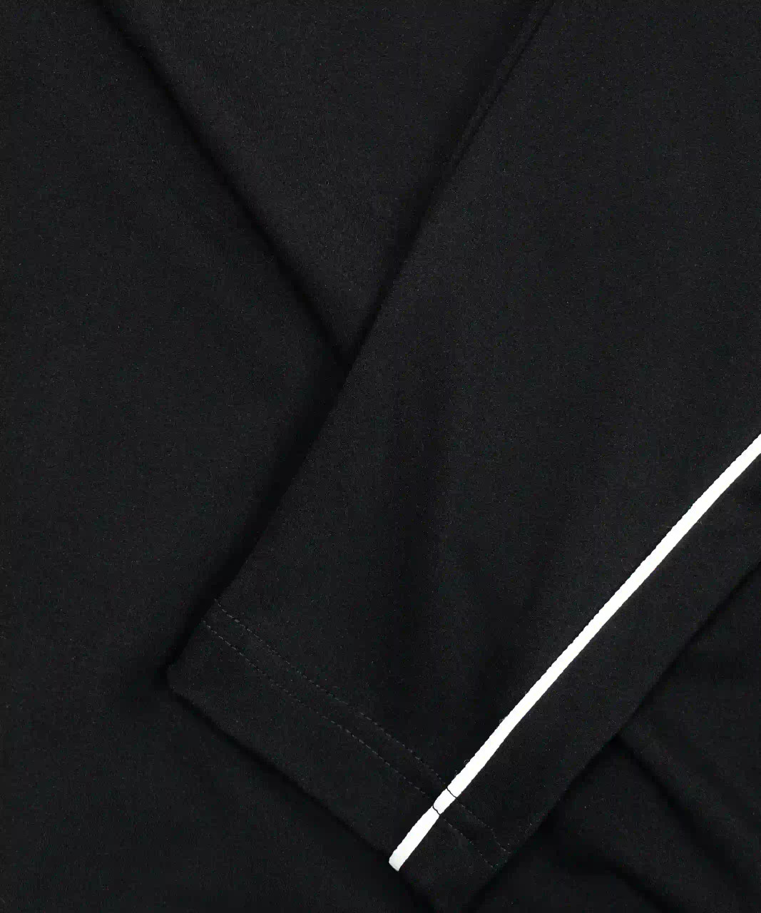 Close-up of stretch performance fabric on men’s training quarter-zip