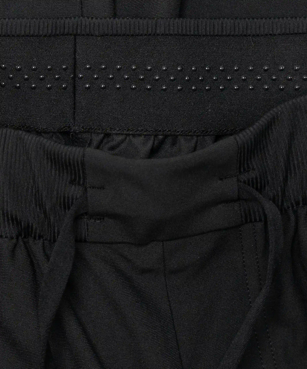 Interior waistband detail of black water-repellent performance joggers