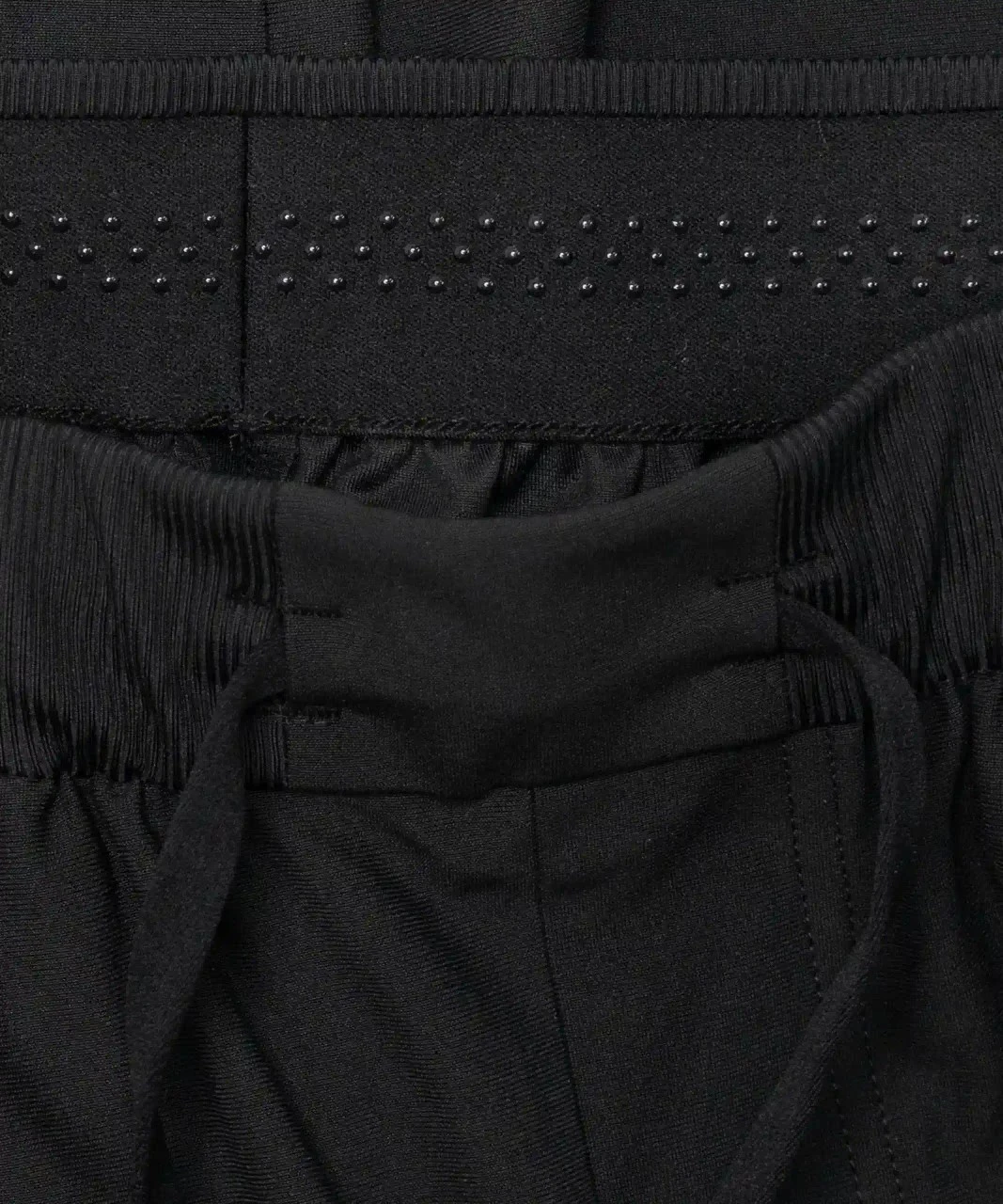 Triumph Jogger, black rubberized waistband with adjustable drawcord, close-up view