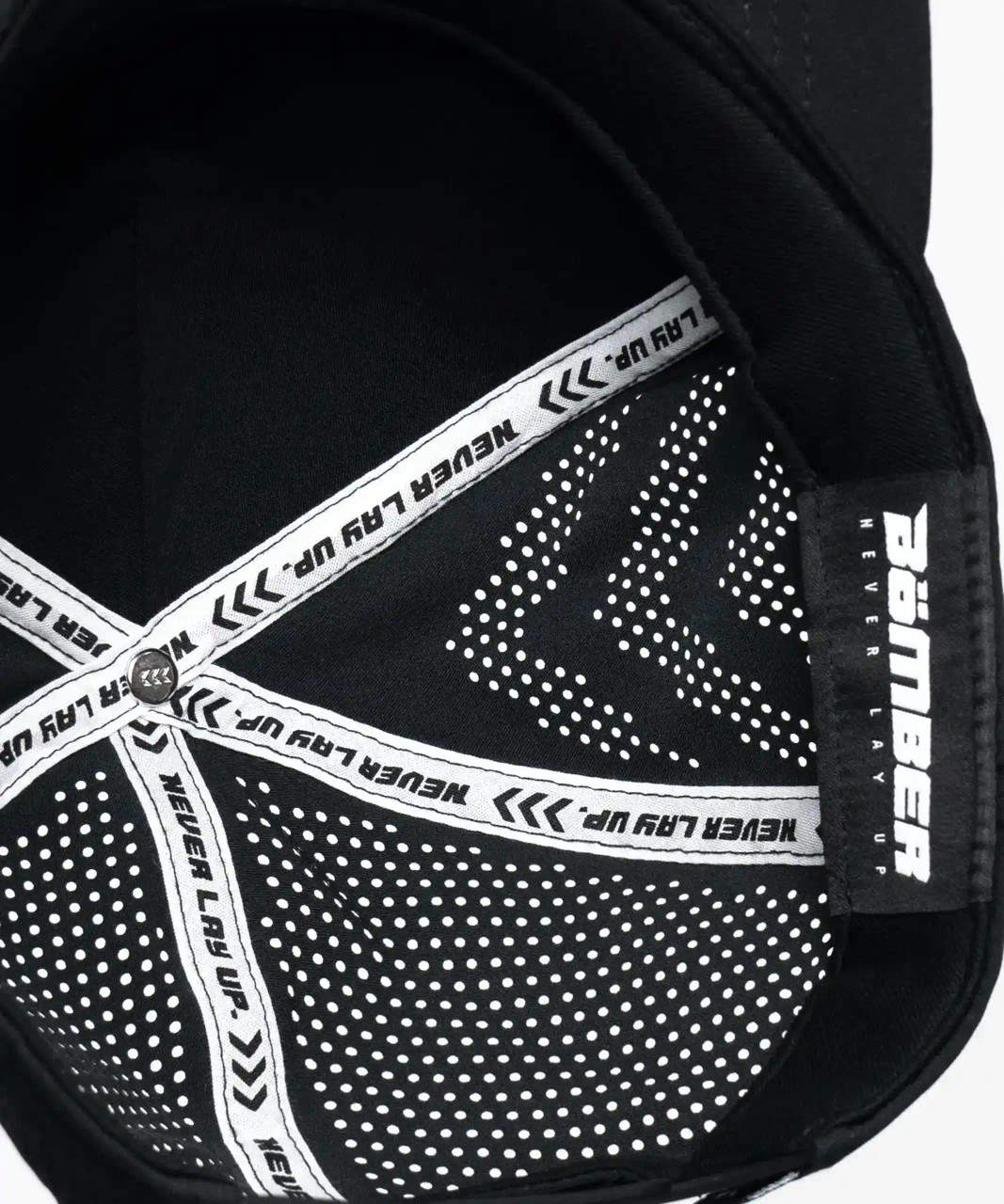 Interior view of black snapback hat with breathable mesh and sweatband