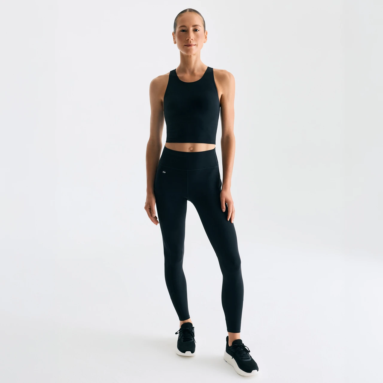 BE Fearless Legging, women's black leggings with high-waisted fit, studio pose