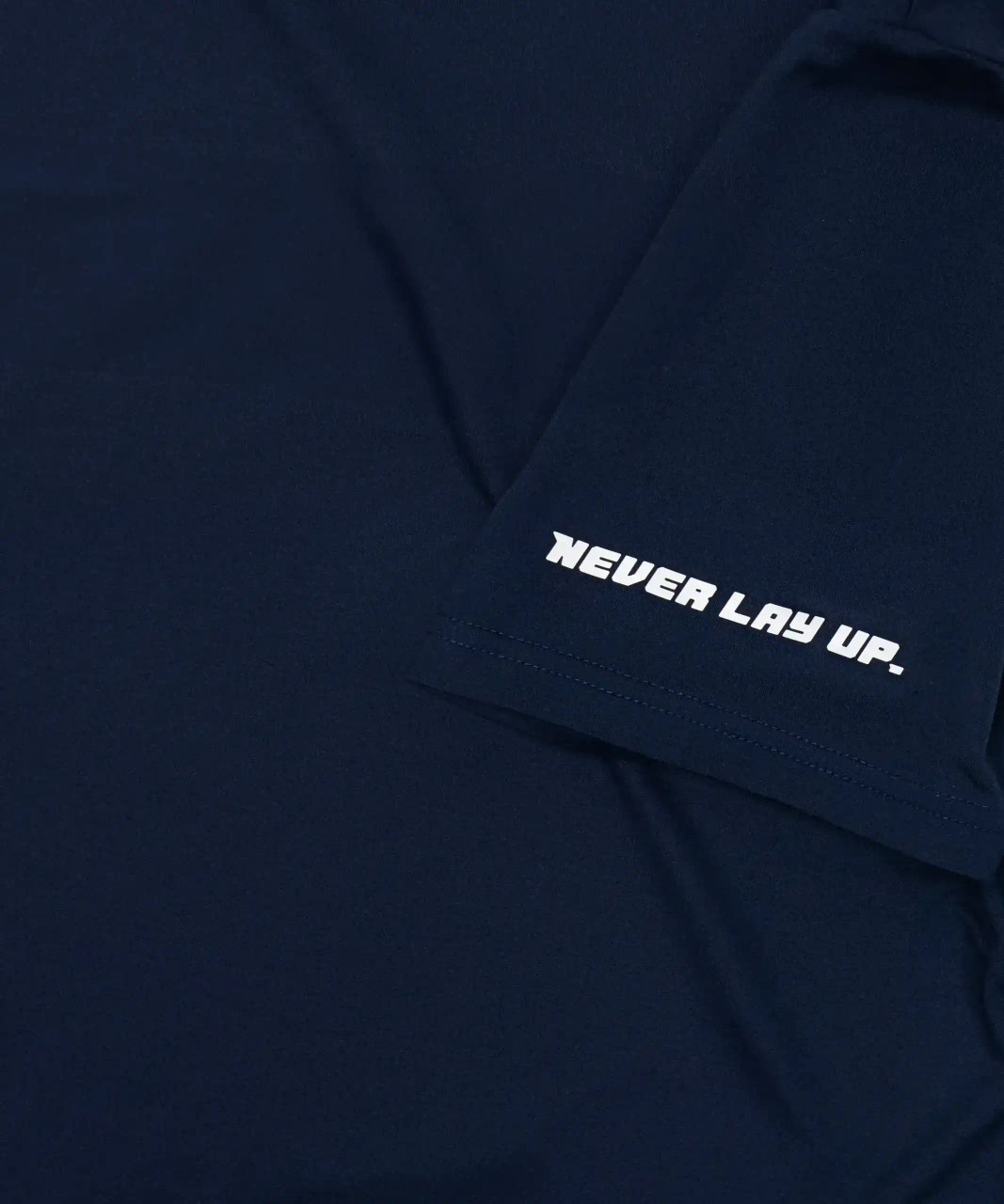 Start T-Shirt, navy performance t-shirt with silicone logo, close-up view