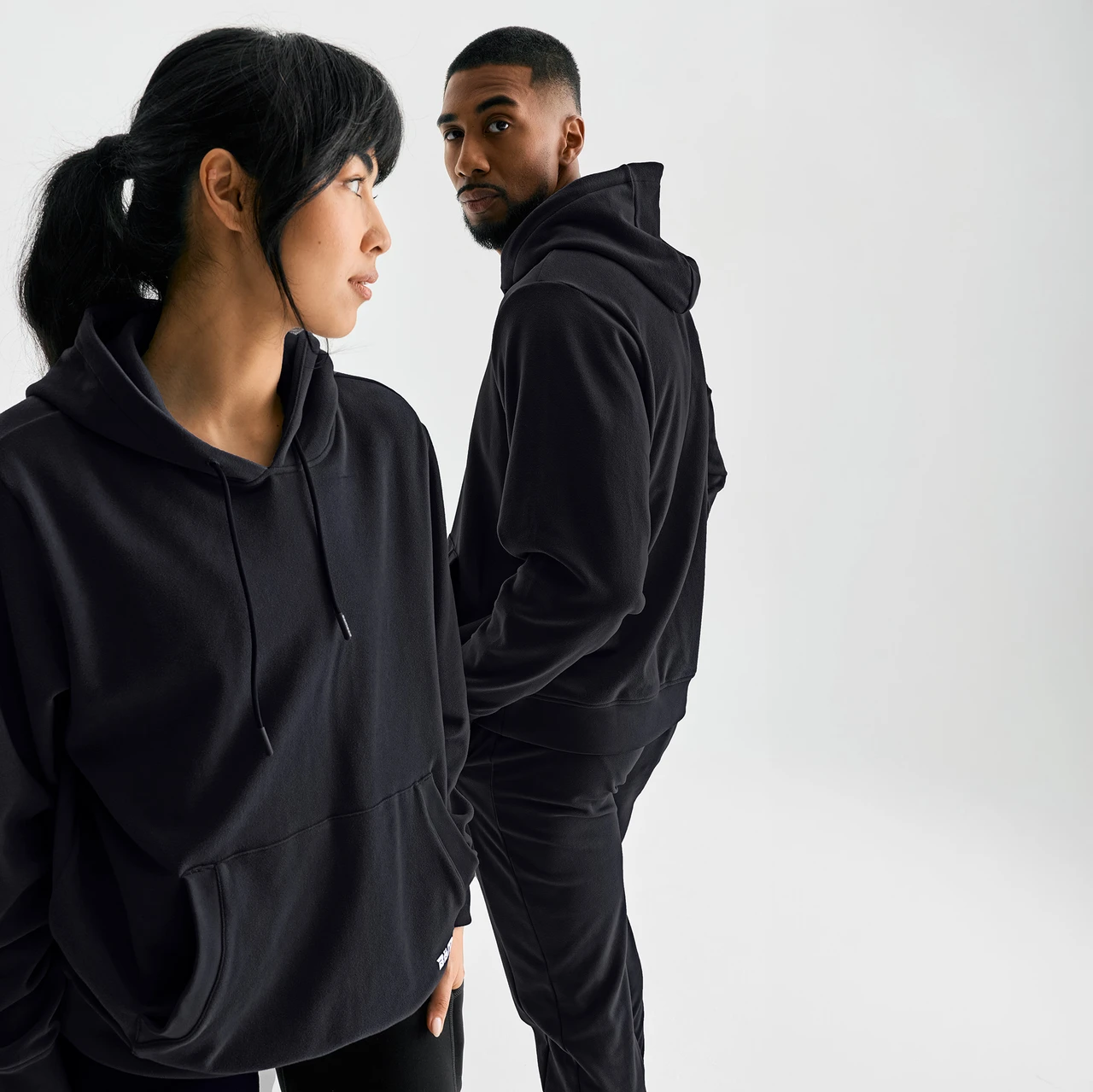 Emerge Hoodie, black performance hoodie, side view