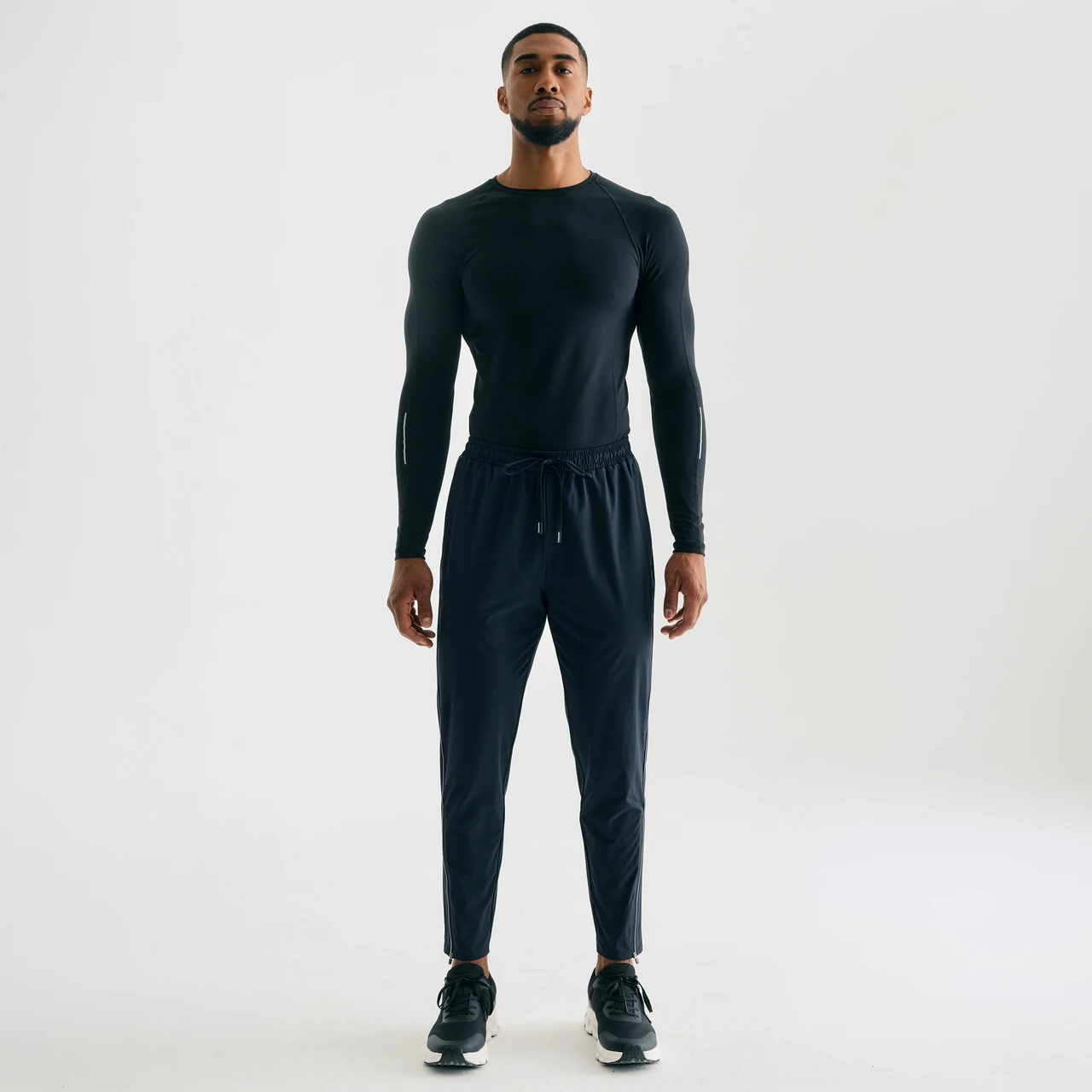 Surpass Pant, men's black jogger pants, standing front view