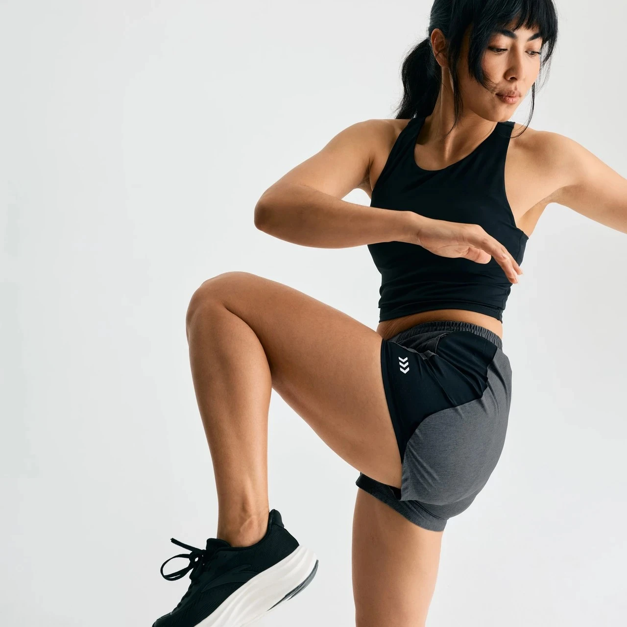 Momentum Active Short, women's Black/Black Heather shorts with 3 inch inseam, kneeling action shot