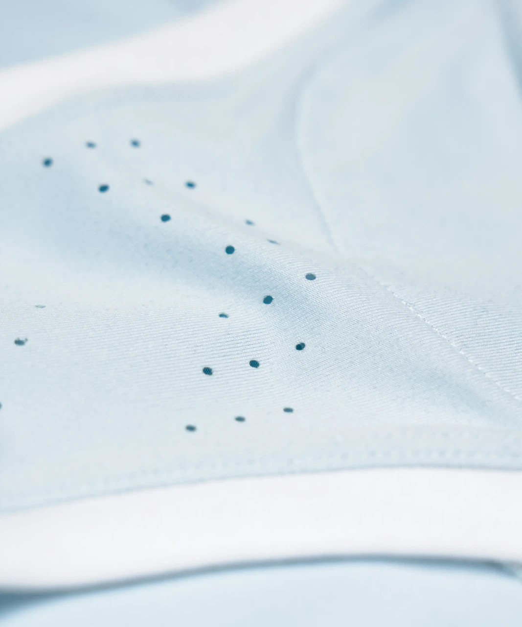 Energize Tank light blue perforated fabric close-up