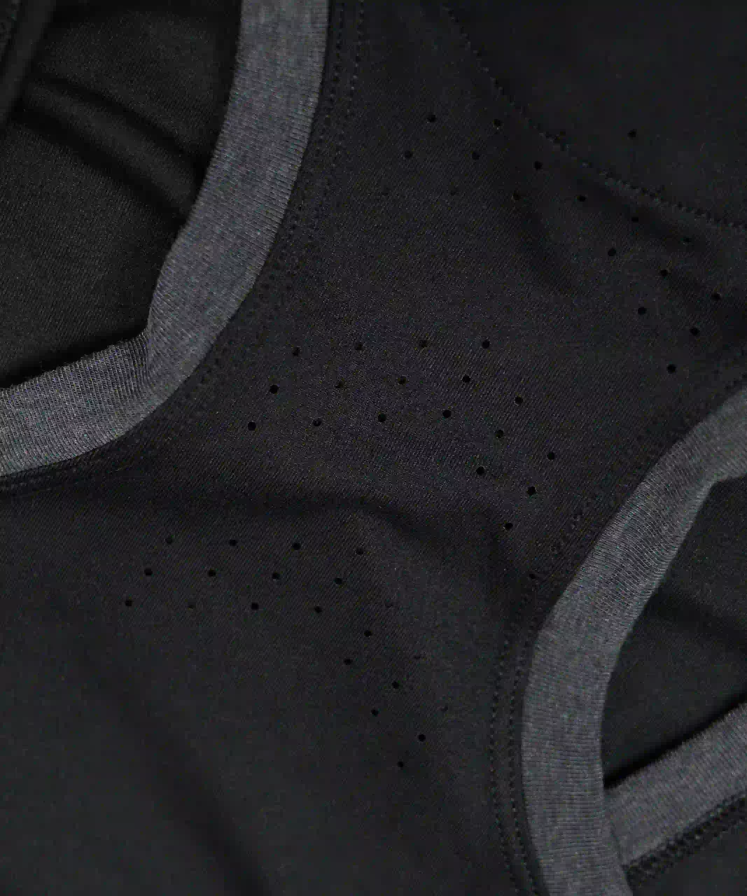 Energize Tank black perforated fabric close-up