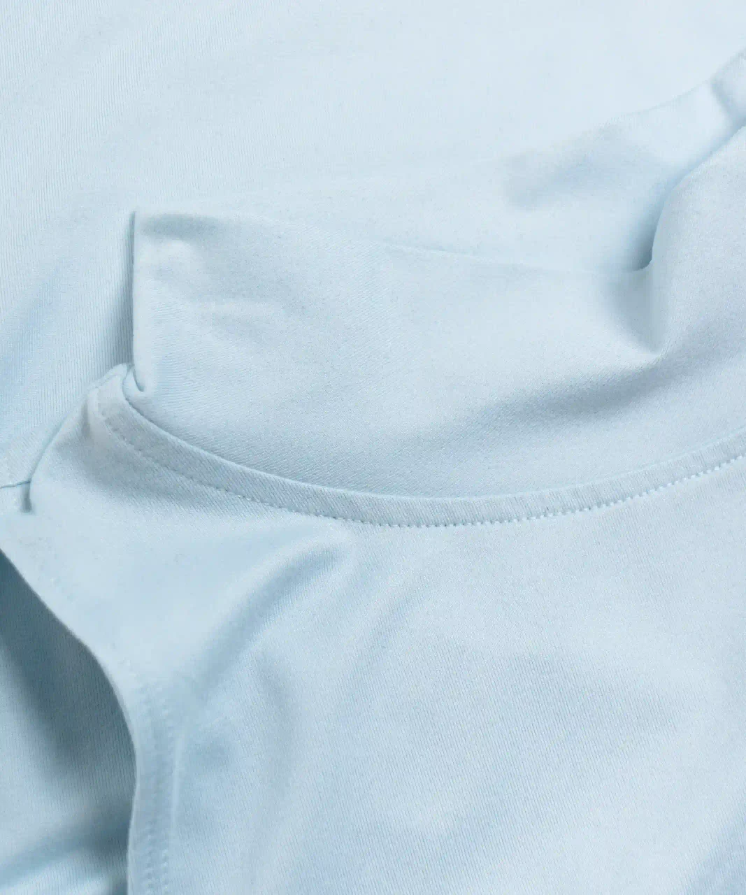 Thrive Tank light blue mock neck close-up