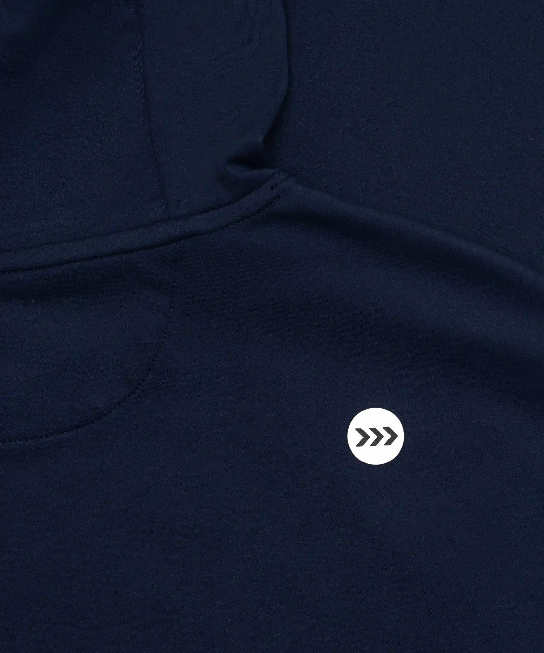 Close-up of silicone logo on navy men’s performance hoodie