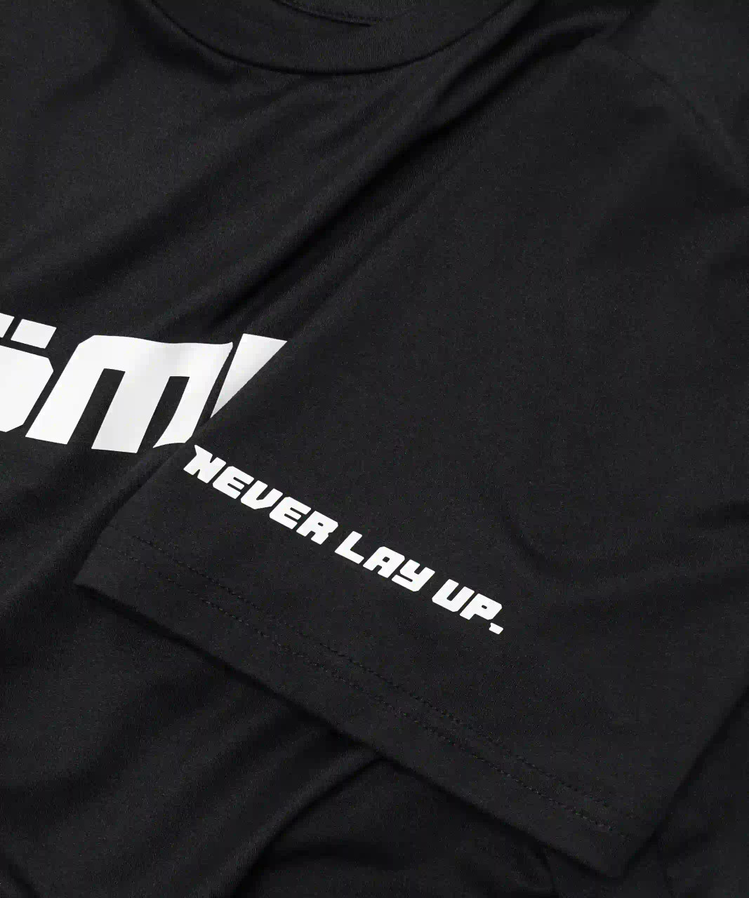 Ignite T-Shirt unisex black sleeve logo close-up