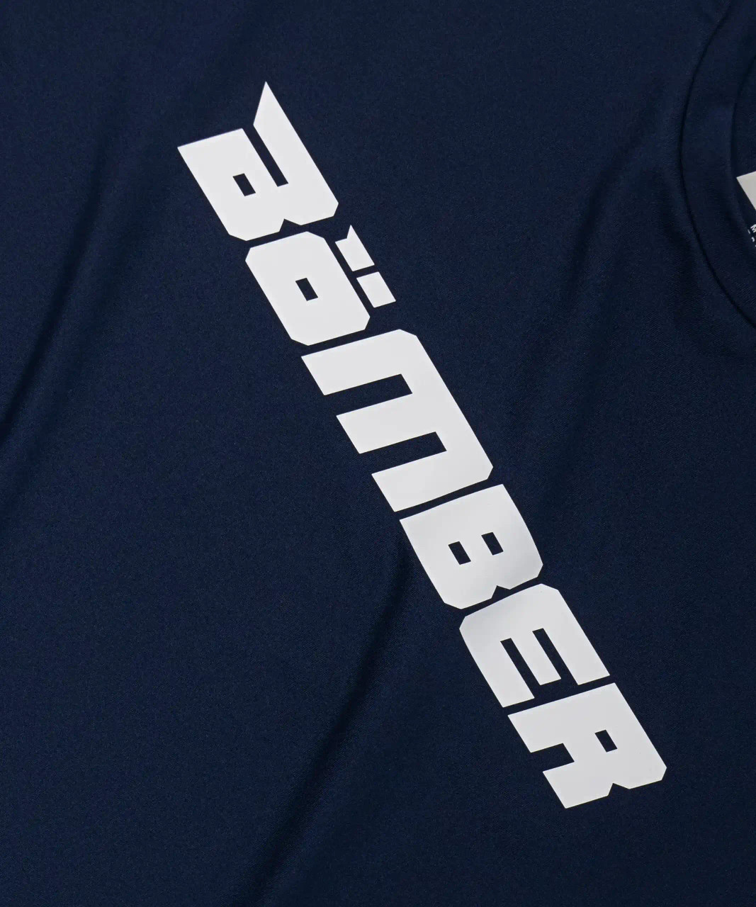 Bomber logo graphic on unisex Ignite T-Shirt in navy