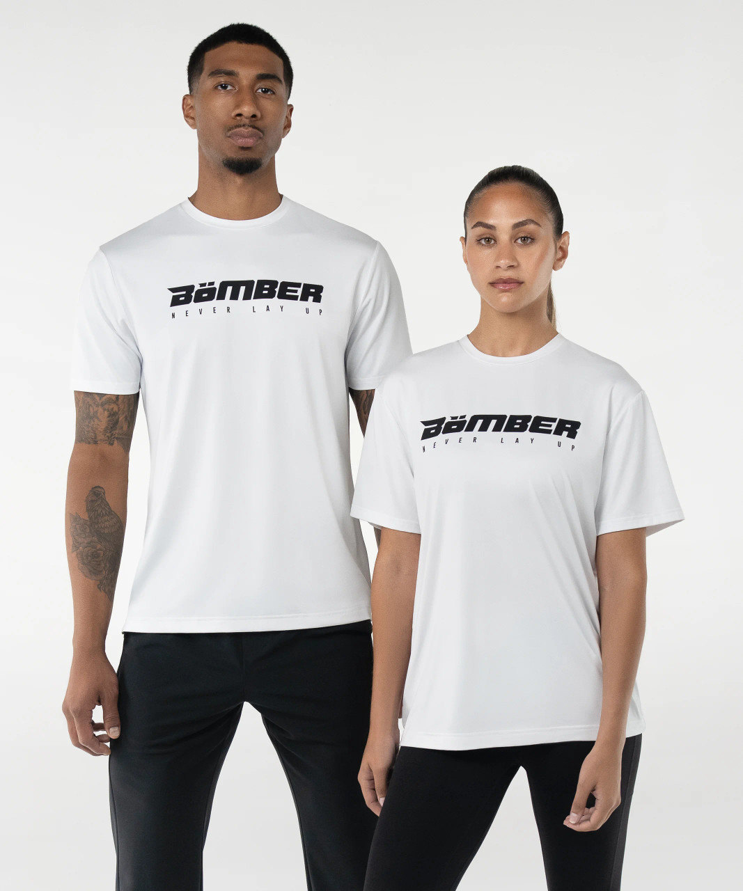 Unisex Propel T-Shirt in white worn by male and female models