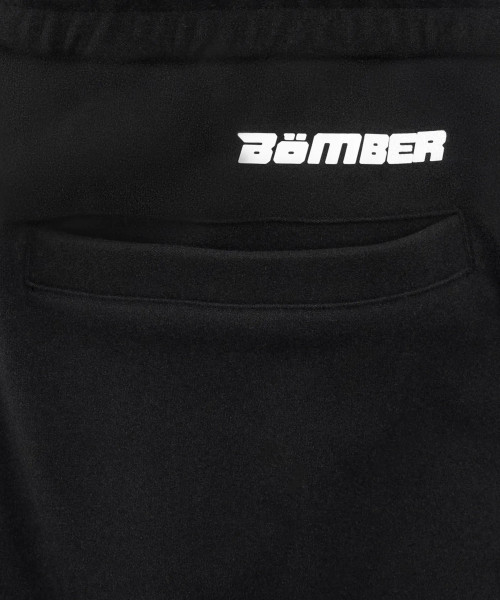 Close-up of back pocket and logo on men’s black jogger pants
