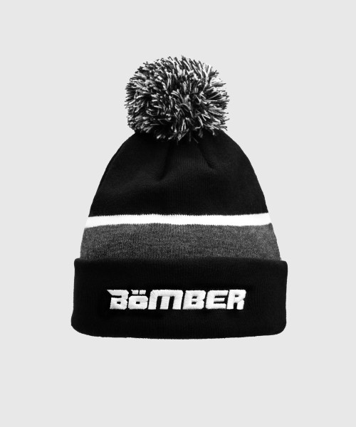 Schwarze Mütze aus Rippstrick mit Bommel und umgeschlagenem Rand