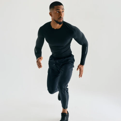 Surpass Pant, men's black jogger pants, running action shot
