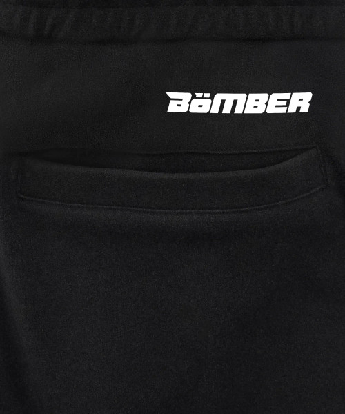 Prime Jogger, black performance joggers with silicone back pocket logo, close-up view