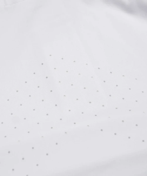 Peak Polo, white HydrApex performance fabric with breathable textured finish, close-up view