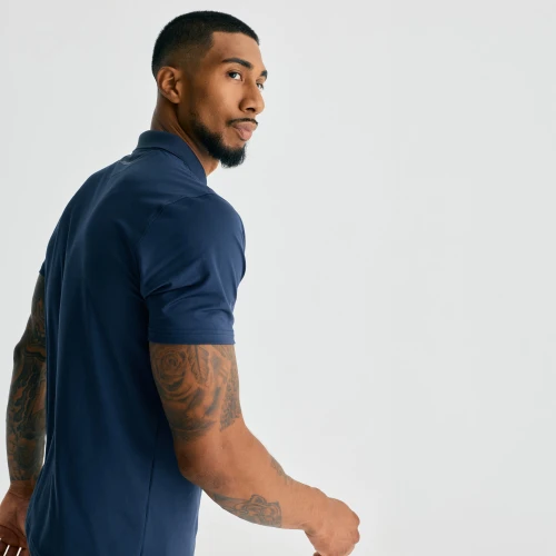 Legacy T-Polo, men's performance navy polo shirt, side walking view