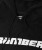 Close-up of Bomber logo on black performance hoodie