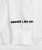 Close-up of slogan graphic on white performance hoodie sleeve