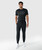 Triumph Jogger, men's black performance jogger with athletic tapered fit, worn by model