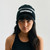 Charge Beanie, unisex black cuffed knit beanie, female model, front view