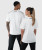 Back view of unisex Surge T-Shirt in white on male and female models