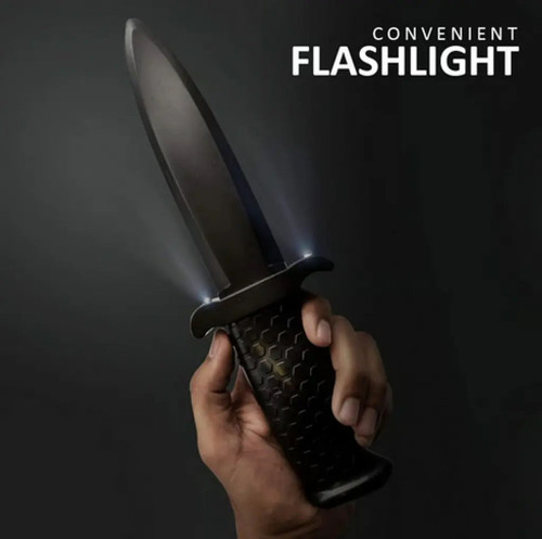 Hand holding stun gun knife while activating the LED flashlight