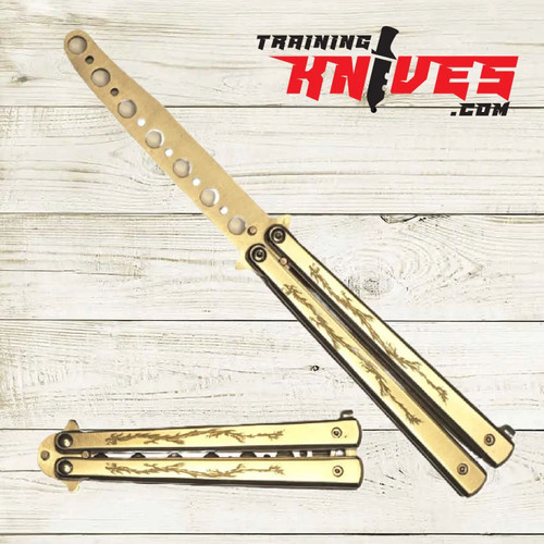 Hero – Gold Dragon 440 Steel Balisong Butterfly Trainer displayed open and closed side by side, featuring unsharpened blade and gold stainless steel handles with detailed dragon engraving Hero – Gold Dragon 440 Steel Balisong Butterfly Trainer displayed open and closed side by side, featuring unsharpened blade and gold stainless steel handles with detailed dragon engraving