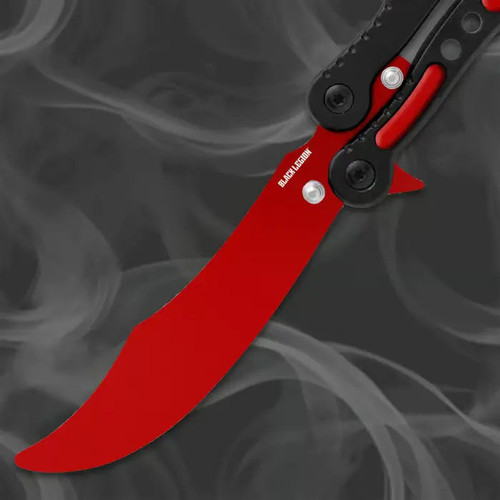 Red scimitar blade butterfly trainer close-up showing curved unsharpened training blade