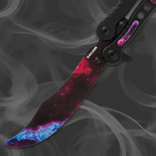 Scimitar style trainer blade close-up on galaxy butterfly balisong trainer