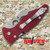 Spyderco Yojimbo 2 CTS-BD1 Red G10 Handle Military Folding Trainer SC85TR2 shown closed with red G10 handle scales and pocket clip visible