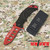 Red folding military trainer with nylon sheath shown beside trainer