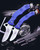 CSSD SC CRMIPT Satin 8Cr13MoV Blue G10 Military Training Knife with two open blades displayed alongside a police shield and handgun in the background