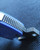 CSSD SC CRMIPT Satin 8Cr13MoV Blue G10 Military Training Knife close up showing handle tip ridges and integrated seat belt cutter