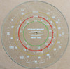 Dial image taken against a tan/brown background to illustrate white portions of dial scale. Dial is clear glass other than scale print.
