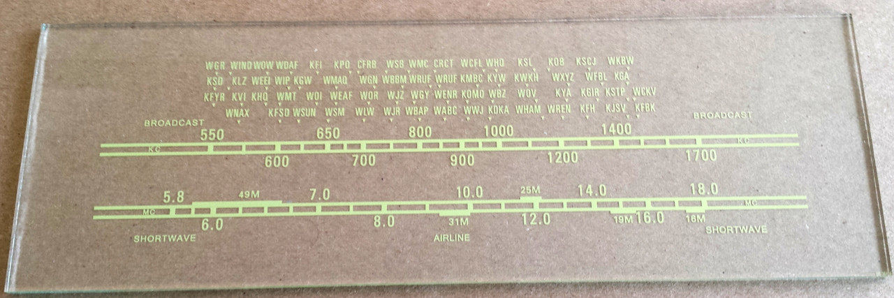 Dial image taken against a tan/light brown background - glass is clear other than printing