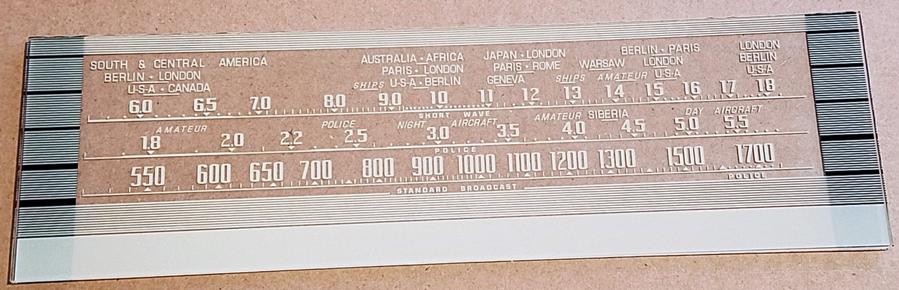 Dial photo taken against a tan background - dial glass is clear other than print