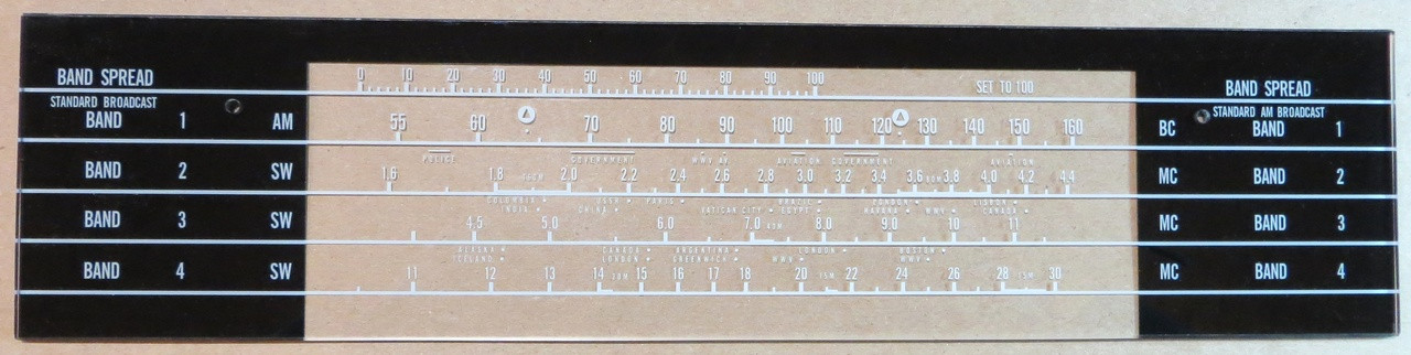 Dial image taken against a tan/brown background to illustrate white dial print. Dial is clear other than dial print areas.