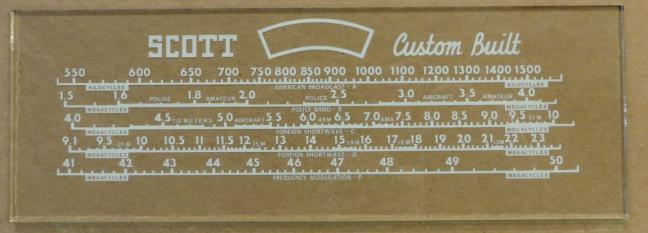 Dial image taken against a tan/brown background to illustrate white dial scale print. Dial glass is clear other than dial scale printing.