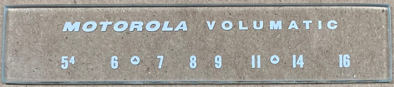 Dial image taken against a tan/brown background to illustrate white dial print. Dial glass is clear other than scale printing.