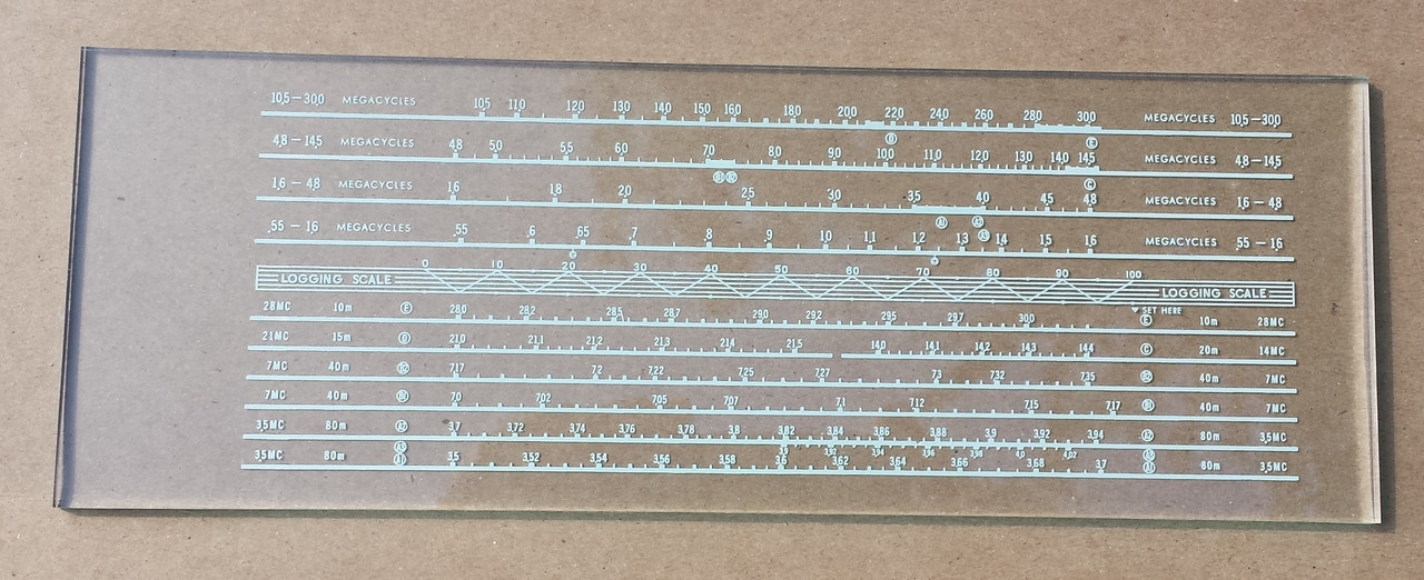 Dial photo taken against tan background to illustrate dial print. Dial is clear glass other than scale.